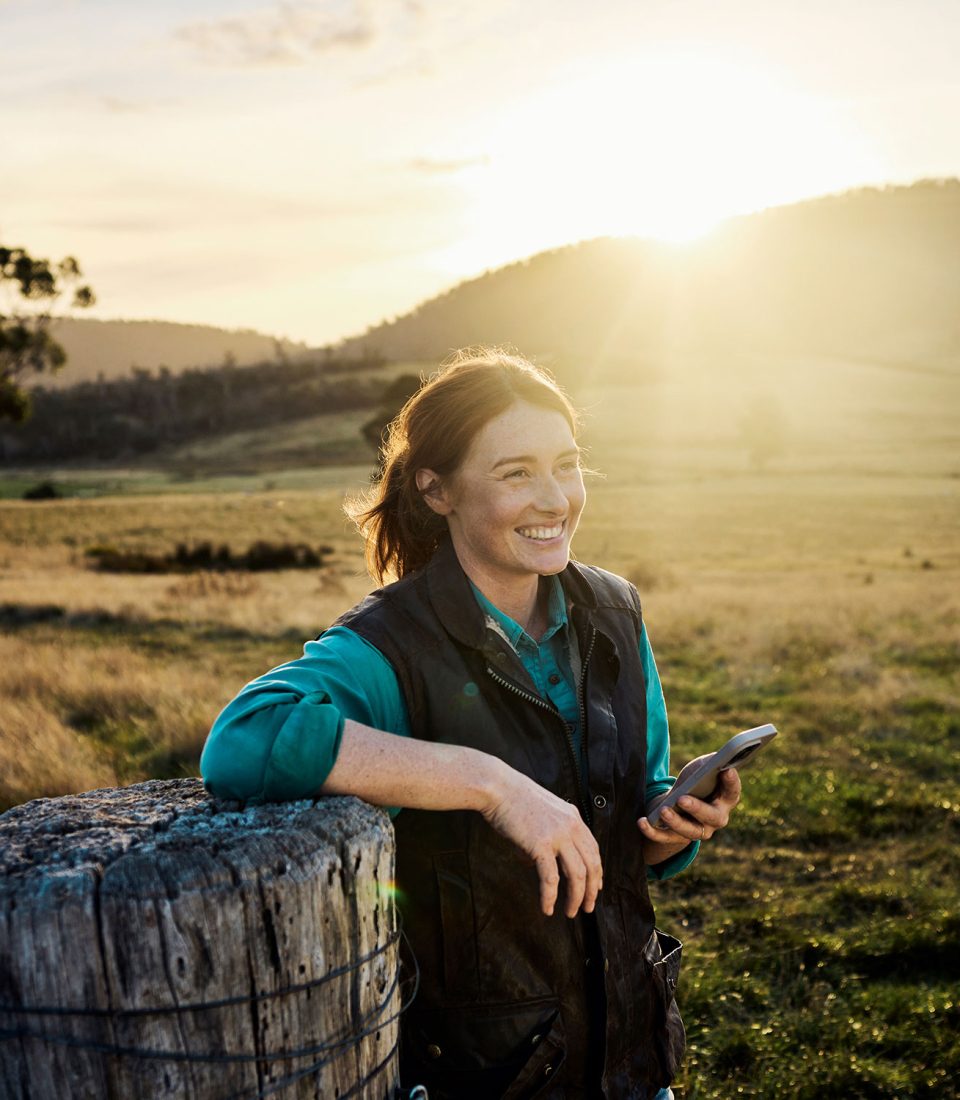 Farmer-Paddock-Sunset-Holding-Phone-Regular