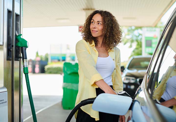 woman filling up at the petrol pump