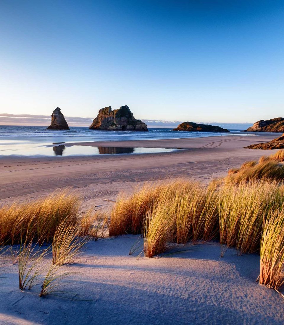 Landscape image of sunset at coastline in New Zealand