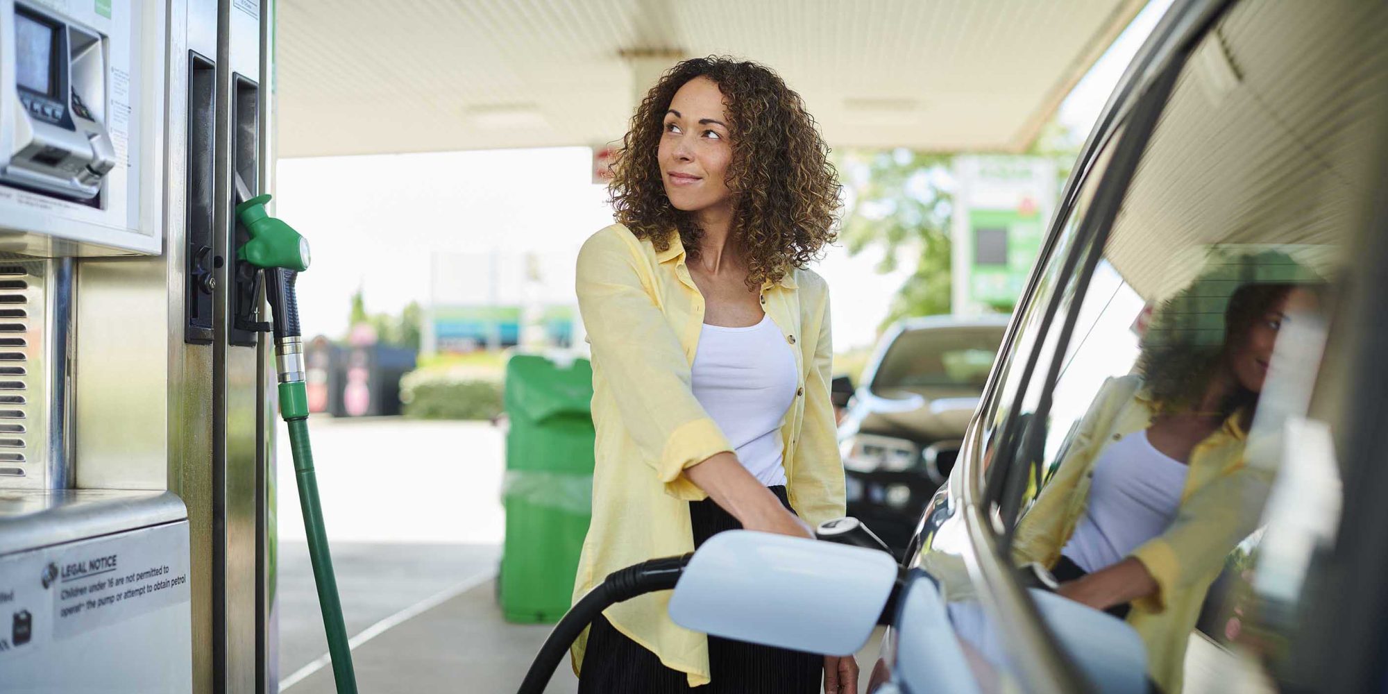 woman filling up at the petrol pump