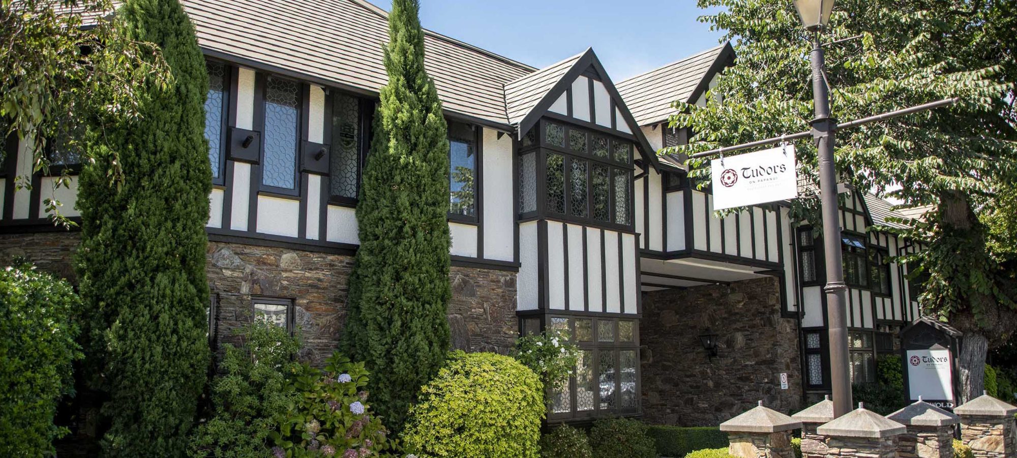 Heartland-Hotel-Cotswold-Exterior-Front-Flowers-Entrance-Banner