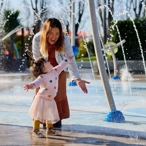 Mother and Daughter playing in the Margaret Mahy Playground fountain. Credit Canterbury Tourism
