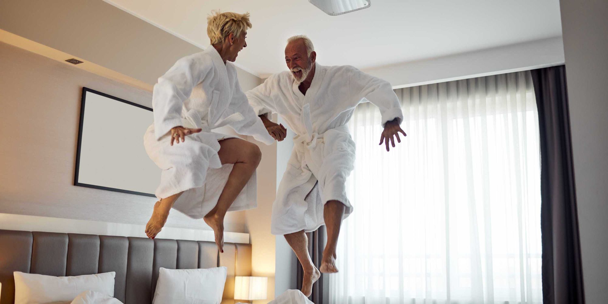 Senior Couple Having Fun in Hotel Room