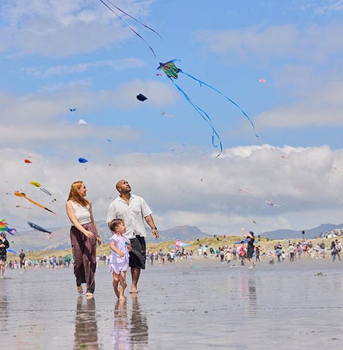 New-Brighton-Kite-Festival-Family-Walking-on-Beach-credit-Christchurch-Tourism-Small