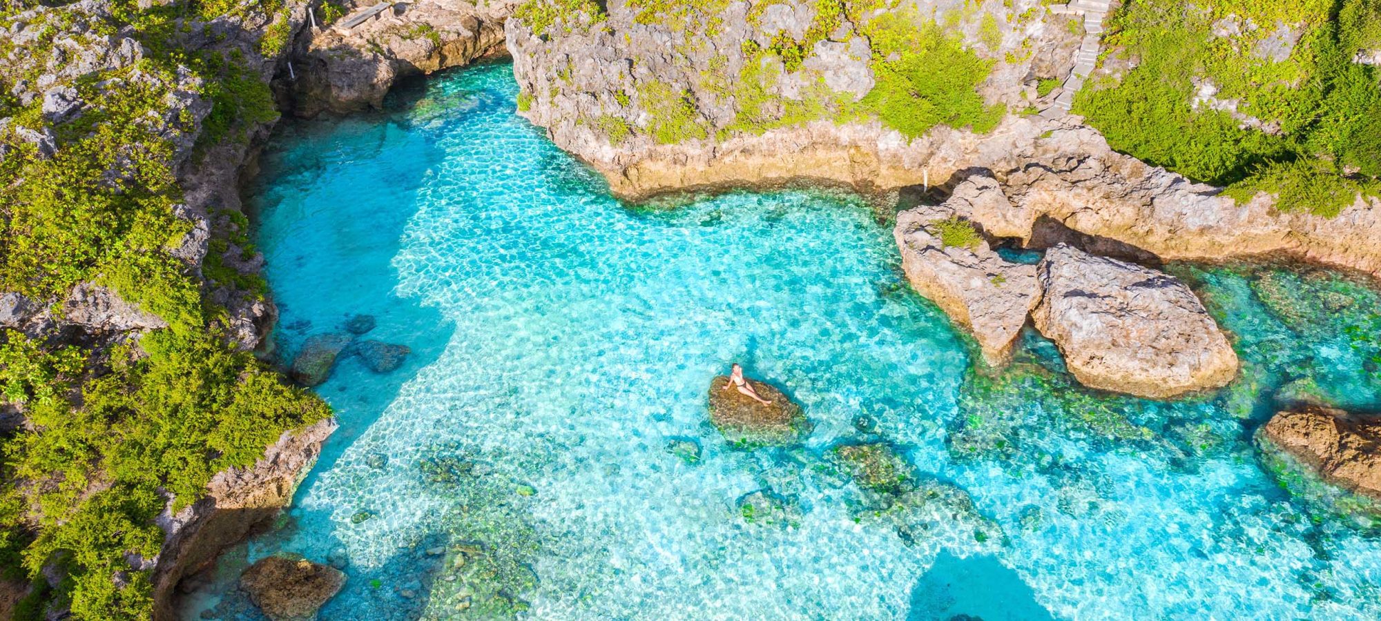 Niue-Island-Limu-Pools-Coast-Ocean-Beach-Scenery-Aerial-Drone-View-People-Banner