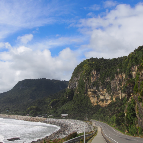 Punakaiki Village, State Highway 6, ocean and limestone cliffs