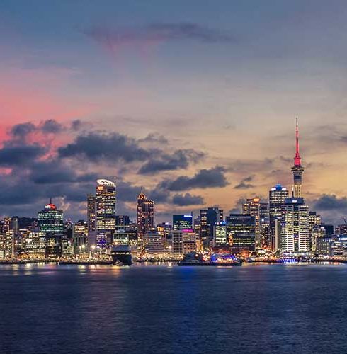 Auckland city with dramatic sunset sky