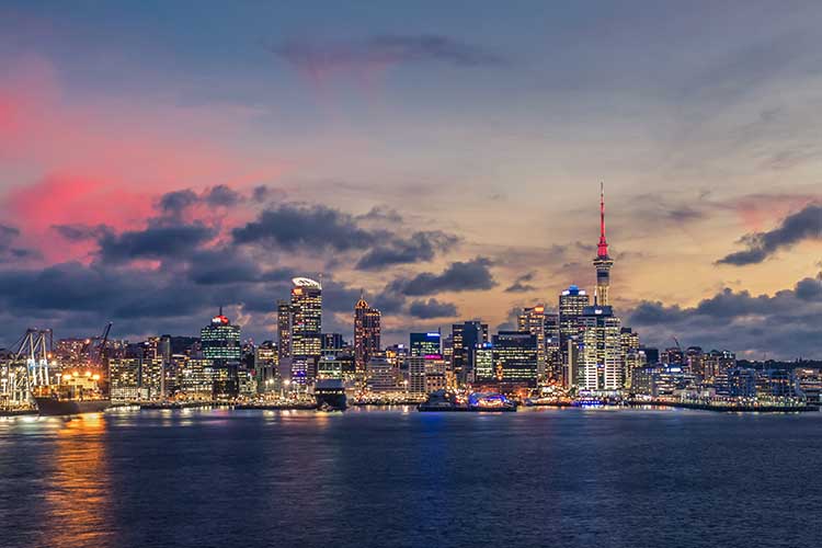 Auckland city with dramatic sunset sky