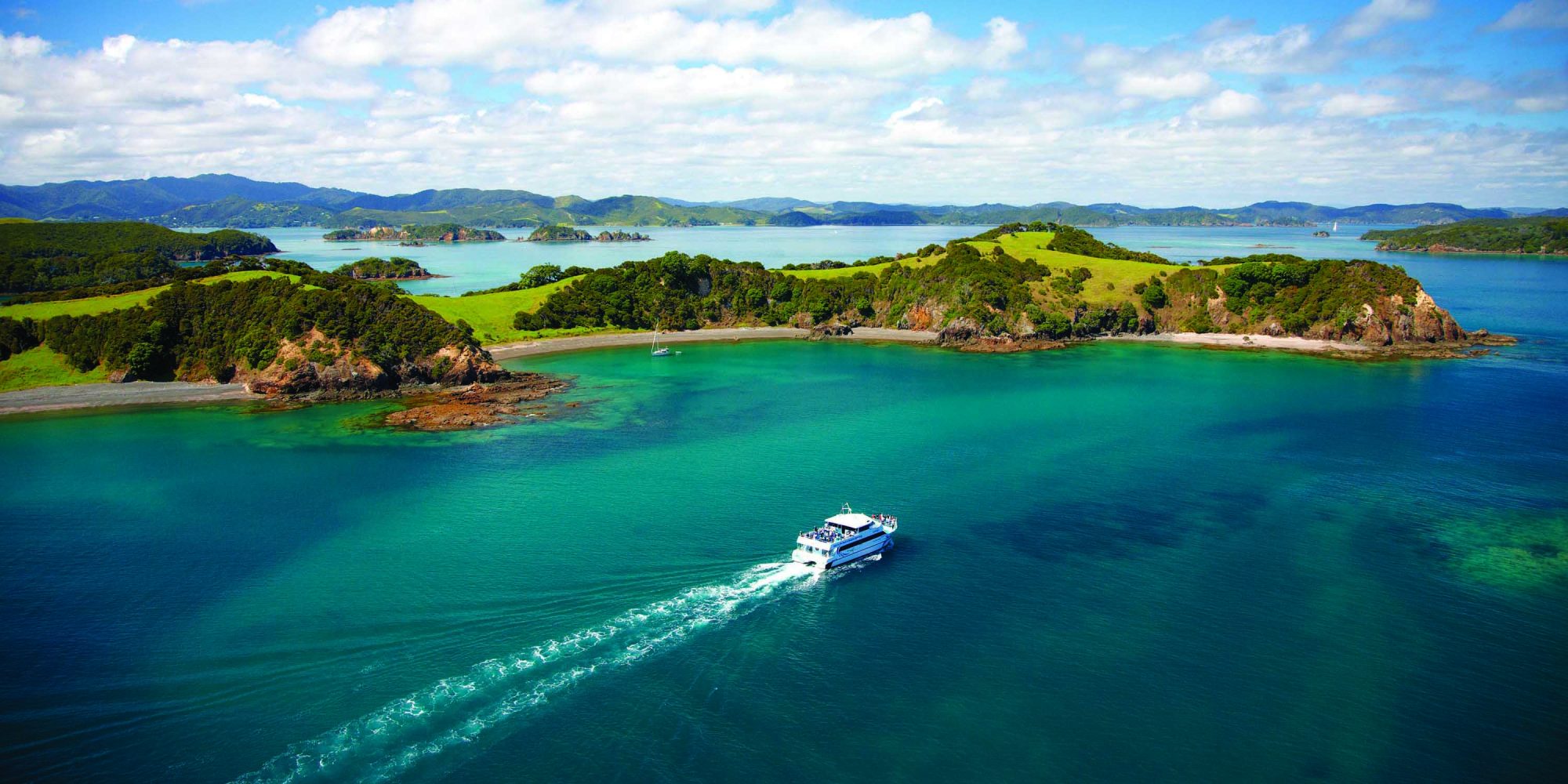 Region-Bay-of-Islands-Aerial-View-Boat-Cruise-Banner