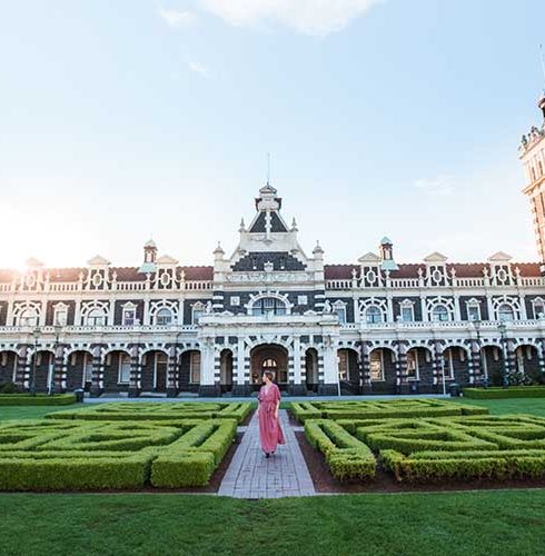 Region-Dunedin-Otago-Railway-Station-Building-Gardens-People-Sunset-Small