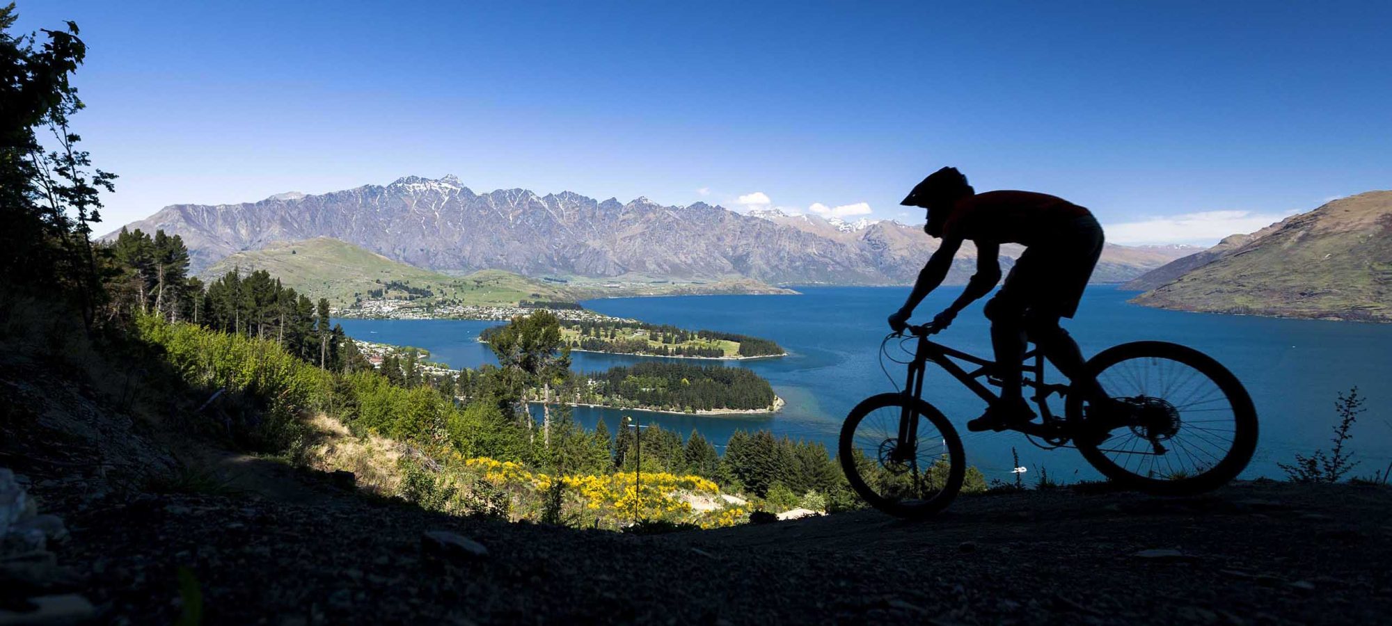 Silhouette of mountain bike rider in Queenstown, New Zealand