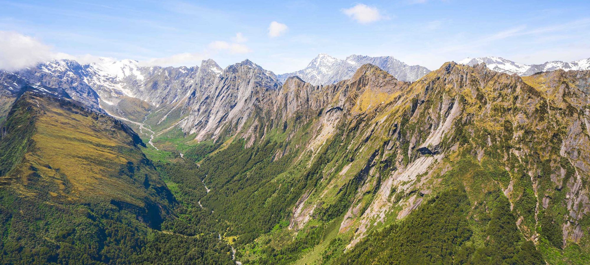 Region-West-Coast-Helicopter-Flight-View-Mountains-1-Banner