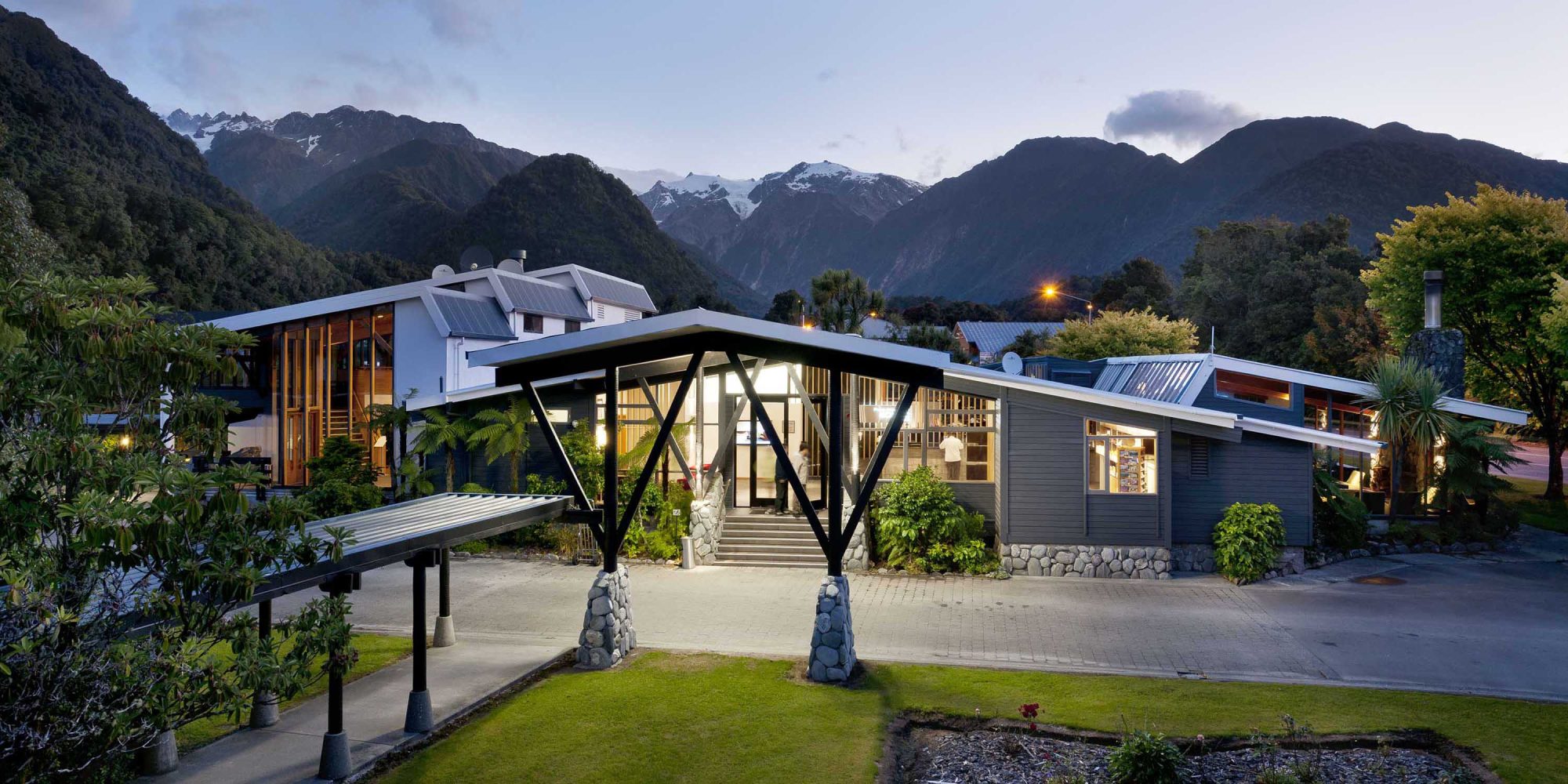 Scenic-Hotel-Franz-Josef-Glacier-Exterior-Night-View-Banner