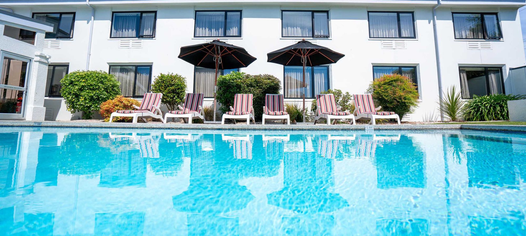 Scenic-Hotel-Marlborough-Exterior-Pool-Chairs-1-Banner