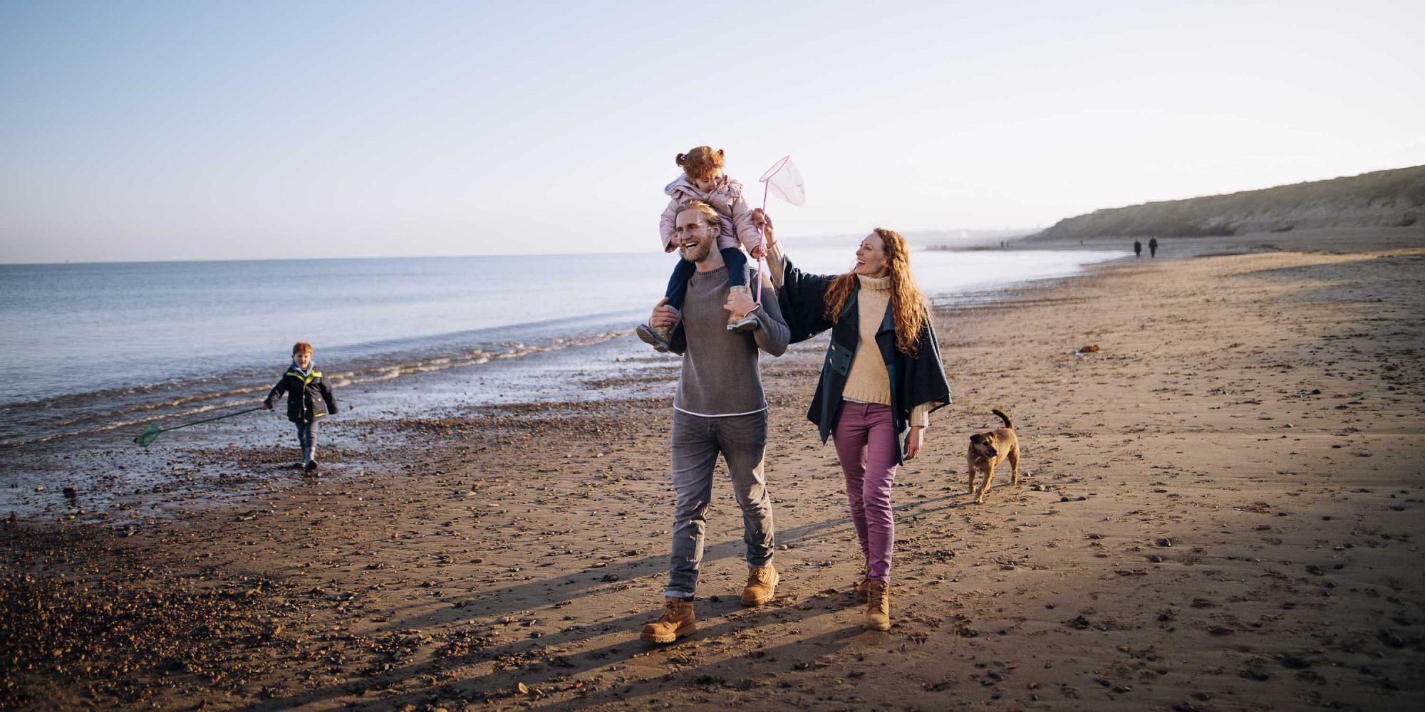 Family on the Beach During Winter