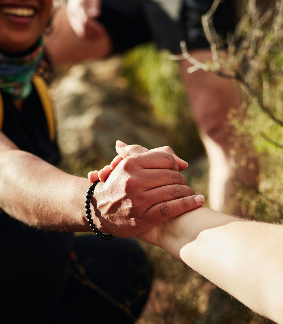 Two-People-Handshake-Helping-Hand-Hiking-Cropped-column-block-Regular.jpg