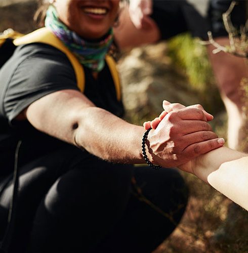 Two-People-Handshake-Helping-Hand-Hiking-Small