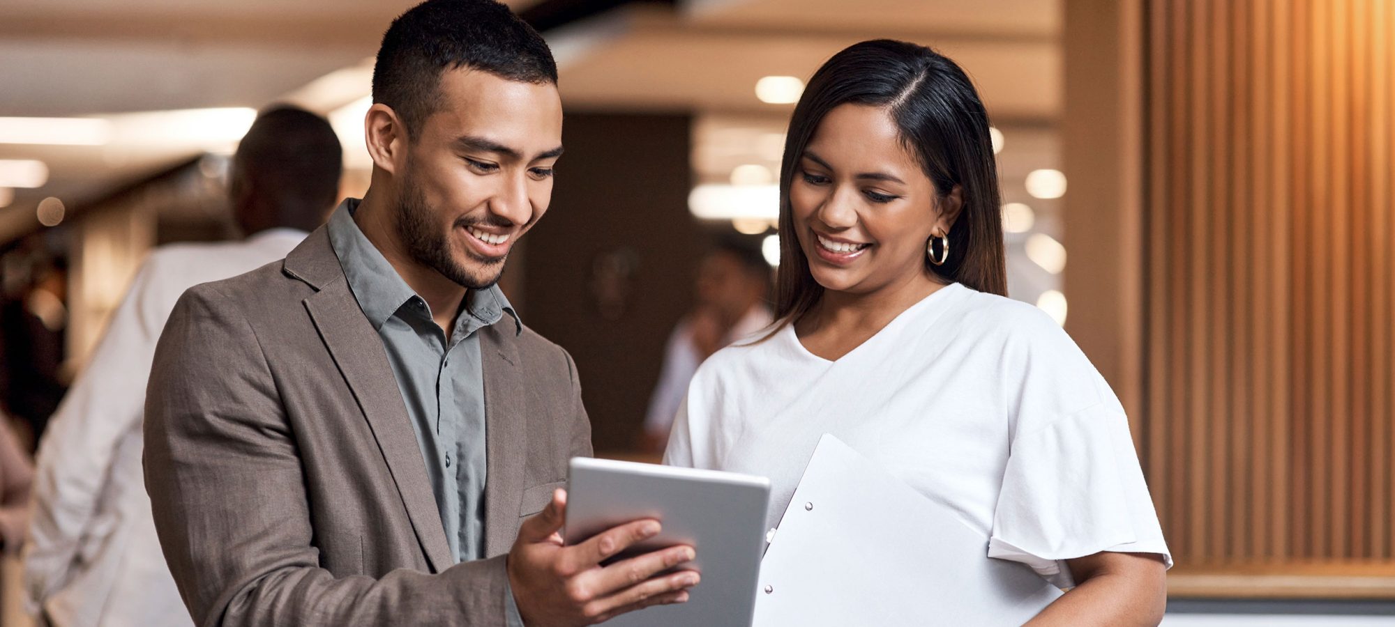 Two-People-Viewing-Tablet-Corporate-Banner
